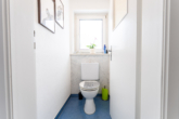 Gäste WC - Helle und einladende Wohnung mit Balkon und Einzelgarage