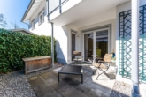 Terrasse - Traumhafte Maisonette-Gartenwohnung mit Saunahaus