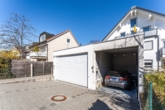 Garage - Traumhafte Maisonette-Gartenwohnung mit Saunahaus